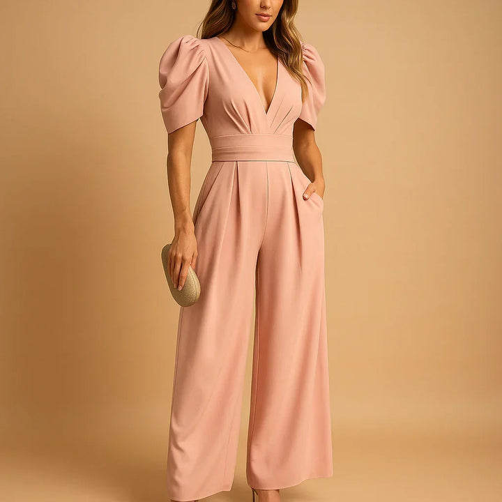 Dames elegante jumpsuit in perzik met pofmouwen en wijde pijpen