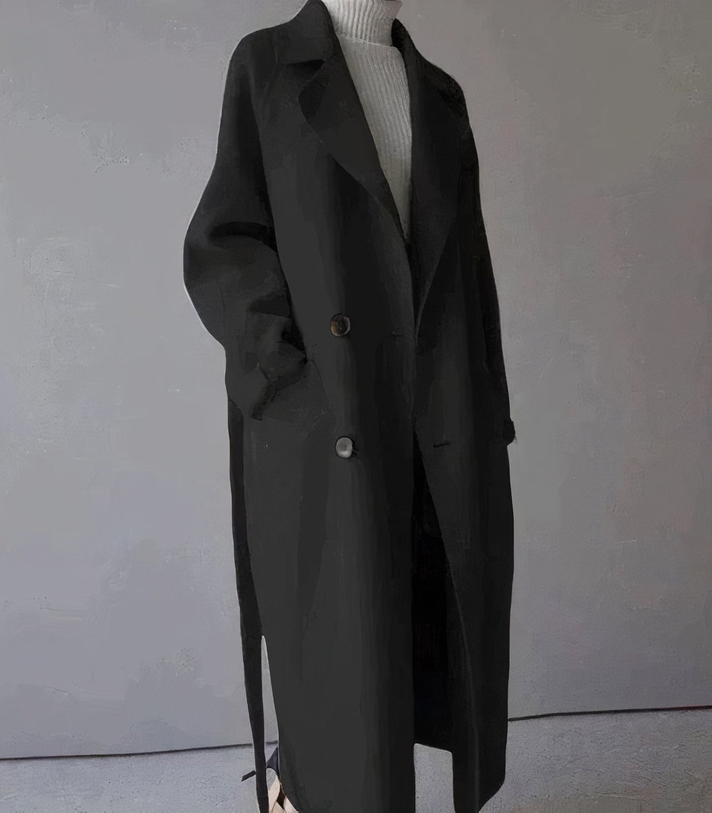 "Lange elegante wollen damesjas in het grijs, warmtehoudend en tijdloos, perfect voor stijlvolle winterlooks."