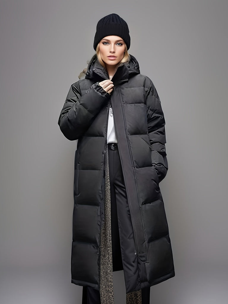 Lange zwarte dames parka pufferjas, warme winterjas uit de nieuwe collectie. Comfortabele en modieuze outerwear.