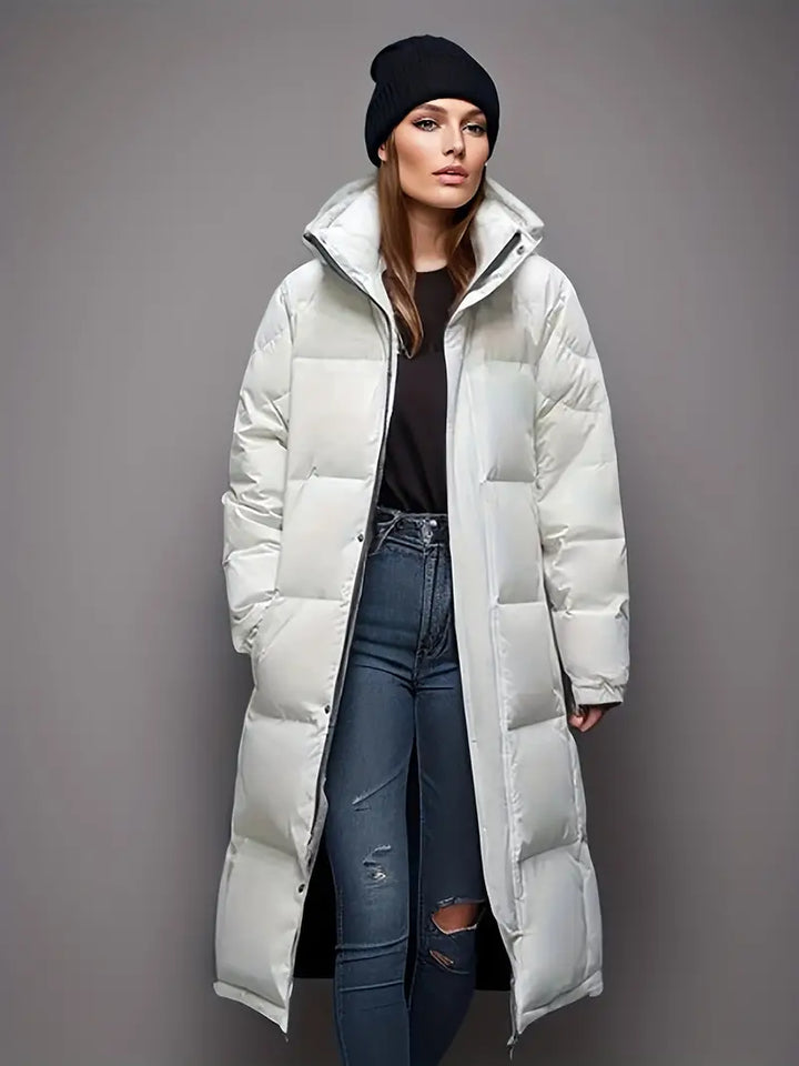 Lange dames parka pufferjas in zwart, ideale warme winterjas voor comfortabele wintermode. Nieuwe collectie.
