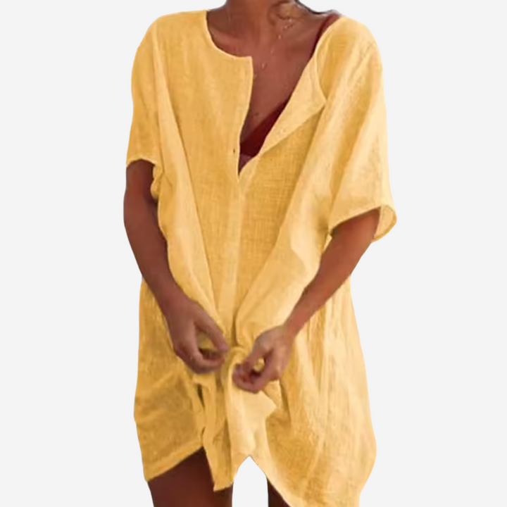 Witte dames strandtuniek, luchtig en veelzijdig. Comfortabele strandkleding en perfecte cover-up voor de zomer.