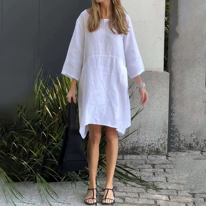 Losvallende Malia zomerjurk voor dames, luchtig en stijlvol, met praktische zakken en trendy kleuren.