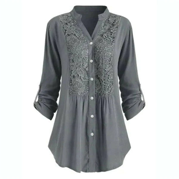 Luchtige damesblouse met pofmouwen, elegant voor zomerse gelegenheden.