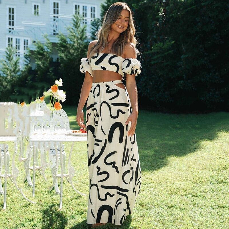 Elegante dames boho set: comfortabele off-shoulder crop top en bijpassende midi rok, perfect voor de zomer.