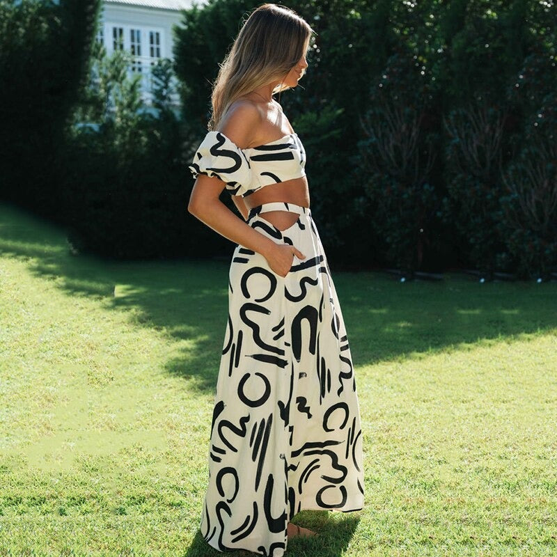 Luchtige dames boho zomer set: off-shoulder crop top en flowy midi rok, ideaal voor strand en terras.