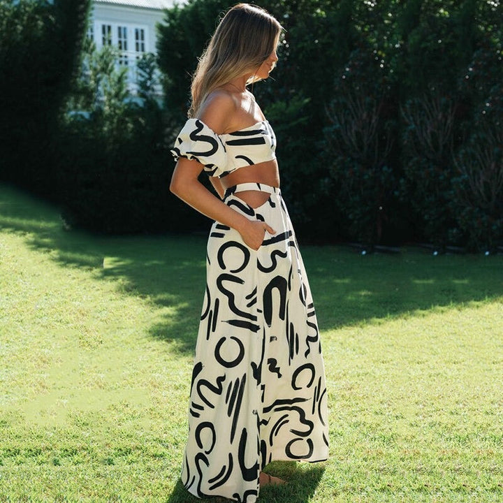 Luchtige dames boho zomer set: off-shoulder crop top en flowy midi rok, ideaal voor strand en terras.