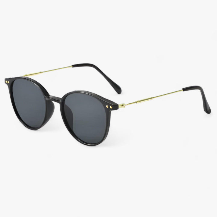 Luxe dames zonnebril Liora met stijlvol rond frame. Perfect mode accessoire met UV400 bescherming.