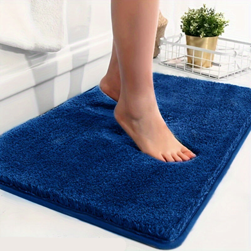 Zachte en absorberende badmat, met antislip functie voor extra comfort.