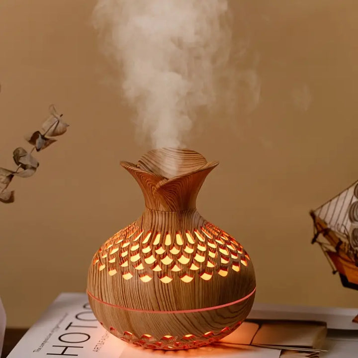 Moderne AromaBloom aroma diffuser met sfeerlicht, ideaal voor ontspanning en stijlvol interieur.