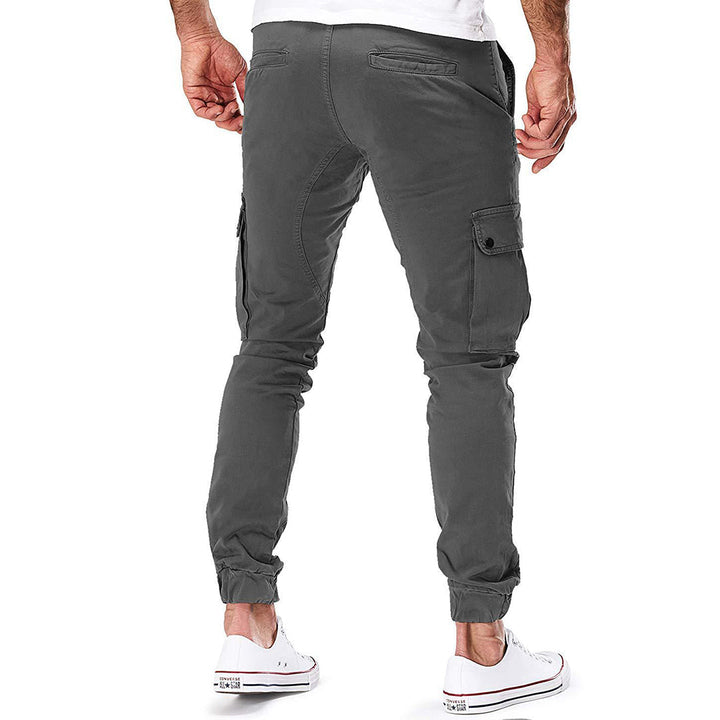 "Moderne heren cargo broek met elastische taille, ruime zakken en trendy ontwerp voor comfort en stijl."