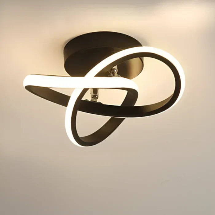 Zwarte moderne LED plafondlamp, creëert een sfeervolle en energiezuinige lichtbron in huis.