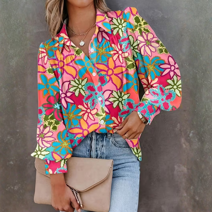 Modieuze damesblouse met veelkleurige bloemenprint, lange mouwen en knoopsluiting. Casual chic voor lente/zomer.
