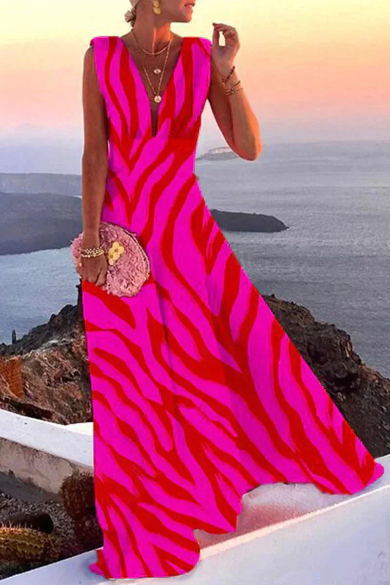Vrolijke mouwloze dames zomerjurk Layla met kleurrijke print, ideaal voor een elegante en luchtige zomeroutfit.