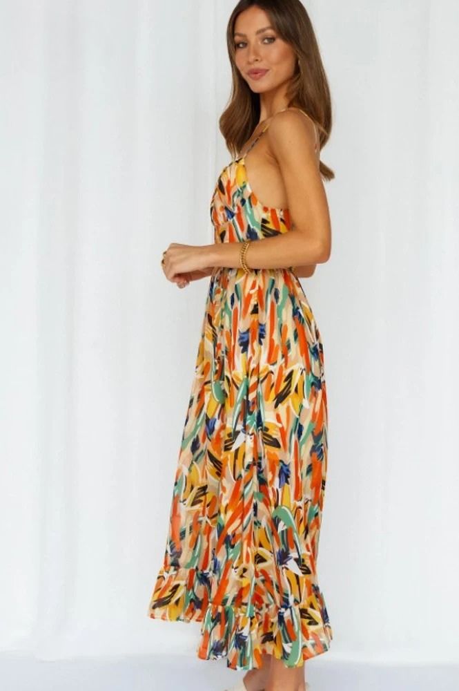 Dames printjurk Isla met v-hals, spaghettibandjes in oranje-turkoois. Mouwloze strandjurk, stijlvol en comfortabel.