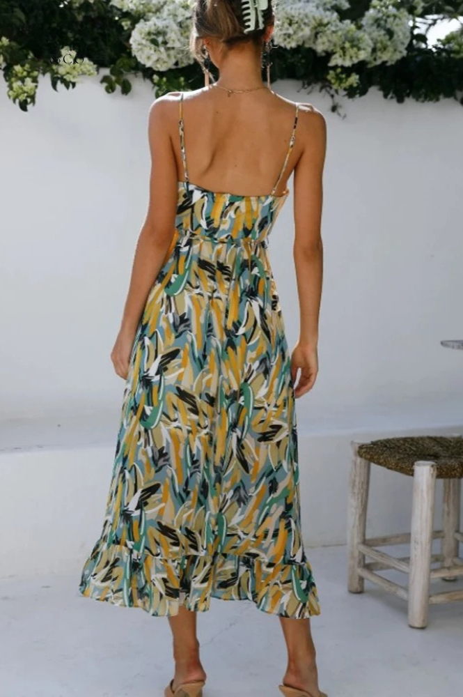 Oranje-turkoois mouwloze dames zomerjurk met vrolijke print. Ideale casual jurk voor vakantie en strand.