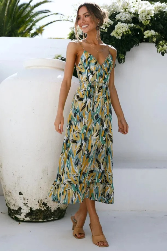 Isla mouwloze zomerjurk met print, v-hals en spaghettibandjes. Comfortabele en stijlvolle dameskleding.