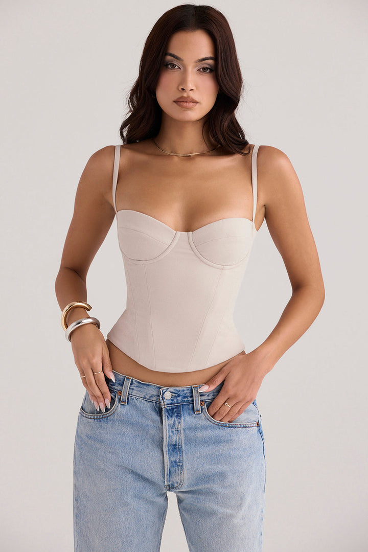 "Oesterkleurige korset top met beugeldesign, chic en comfortabel, nauwsluitende pasvorm, verstelbare bandjes, dameskleding."