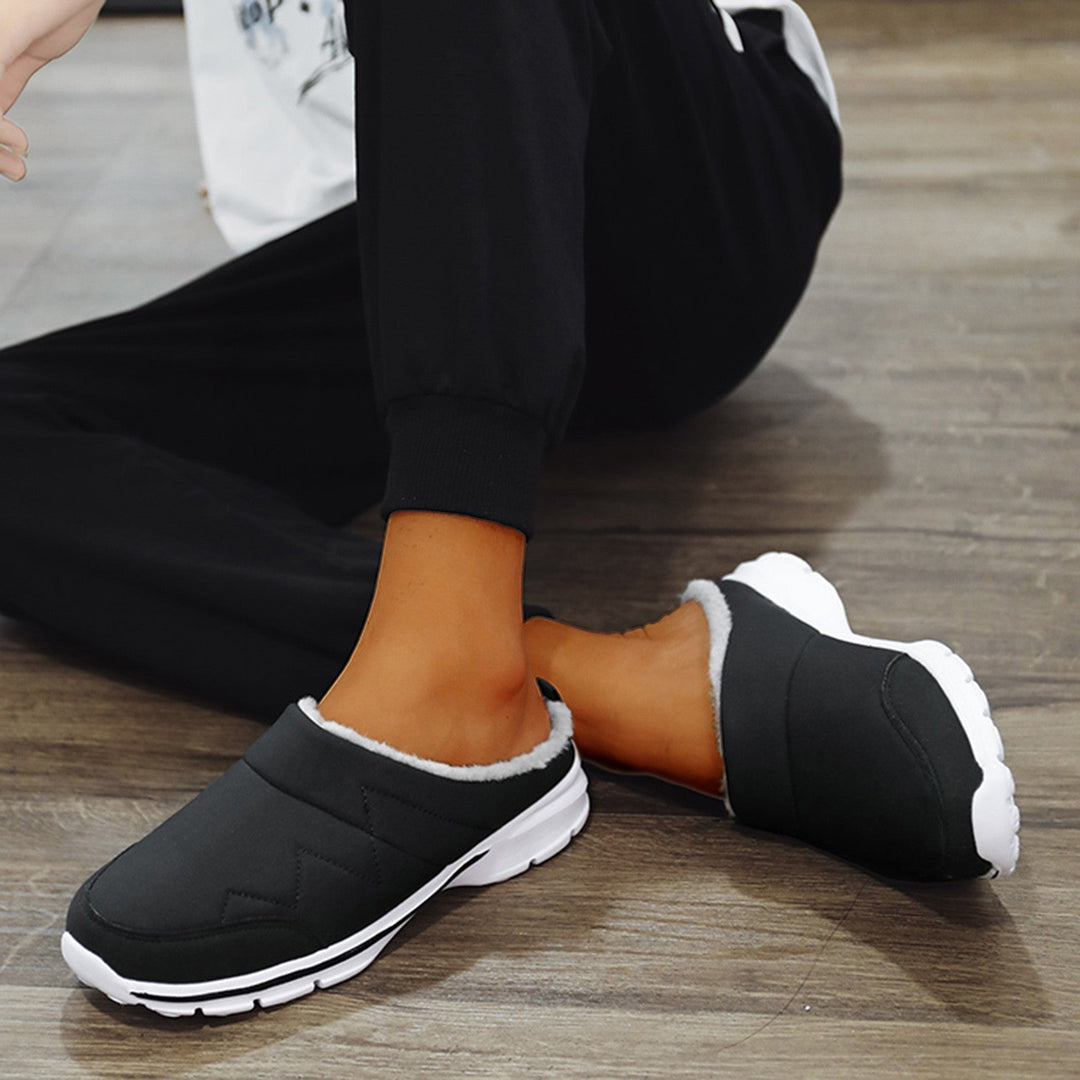 "Orthopedische herenpantoffels met warme voering en stevige antislipzool, perfect voor herfst en winter."