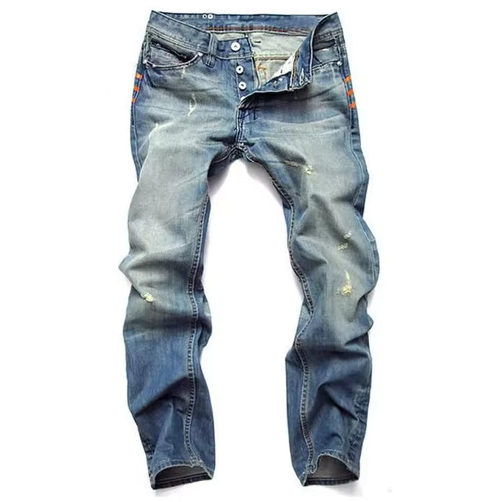 Stijlvolle blauwe herenjeans, slim-fit model met trendy scheuren. Perfect voor een casual of streetwear look.