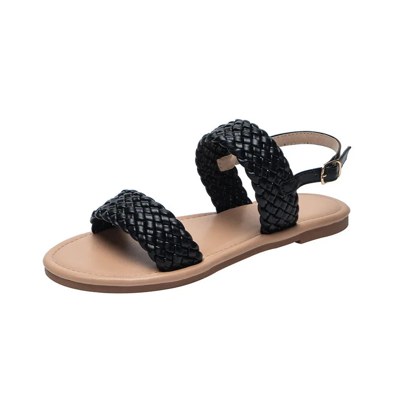 Gedetailleerde close-up van de antislipzool van de platte Elina zomersandalen voor dames.