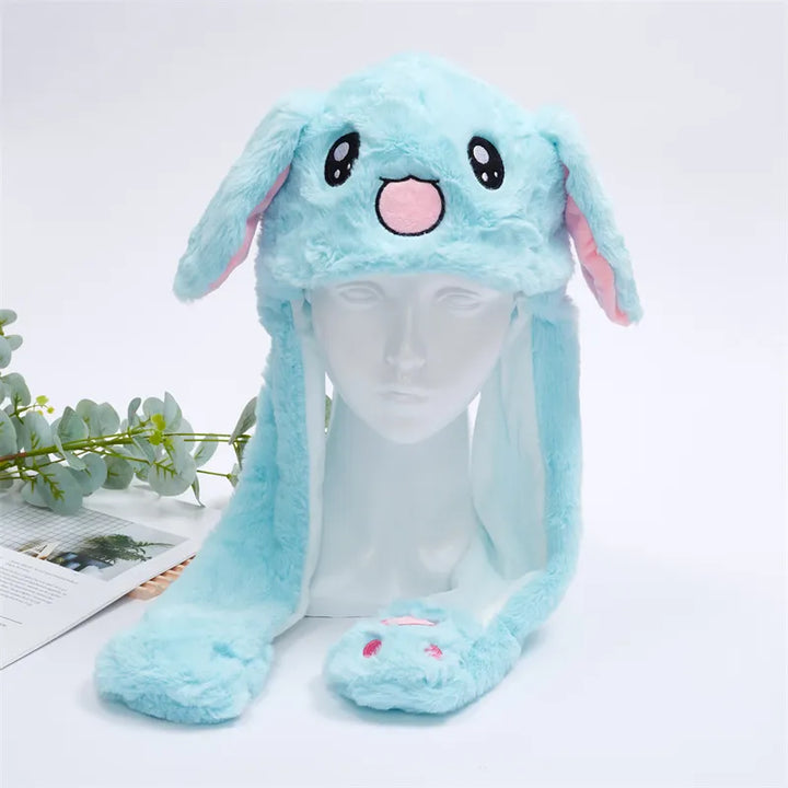 Pluche konijnenmuts met bewegende oren. Schattig en warm voor kinderen en volwassenen.