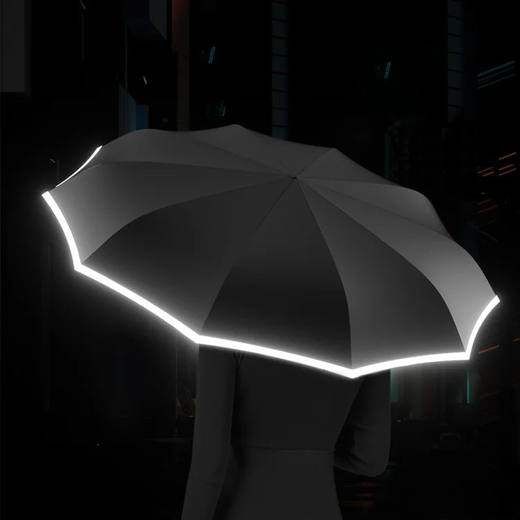Compacte reisparaplu, reflecterend en windbestendig, ideaal voor outdoor gebruik.