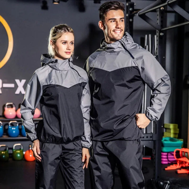 Compleet uniseks trainingspak van Remo met capuchon en ritssluiting, perfect voor elke sport.