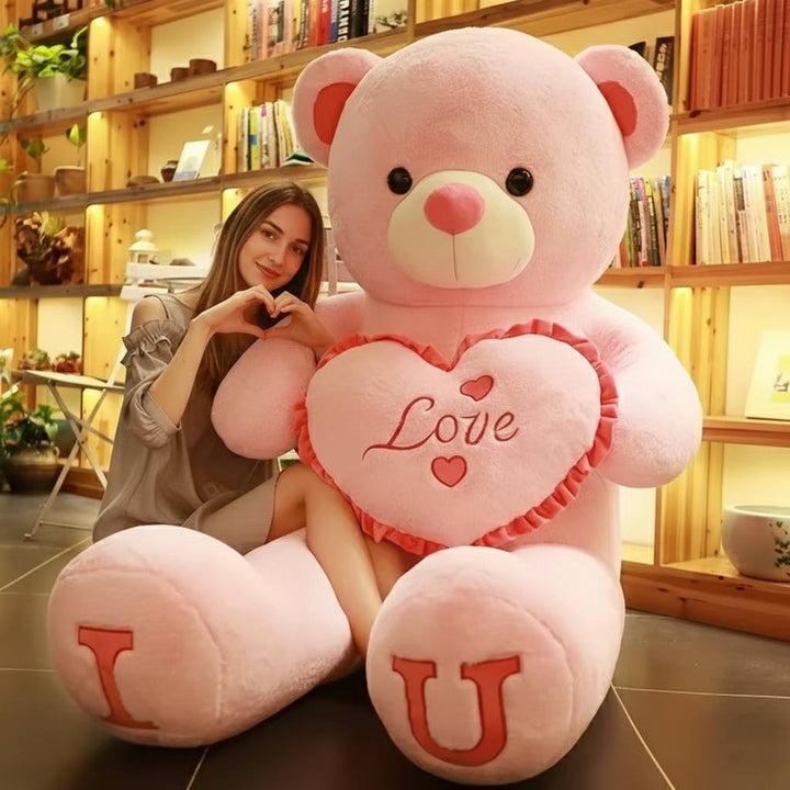 Grote roze pluche teddybeer voor kinderen en volwassenen; heerlijk zacht voor knuffels en huisdecoratie.