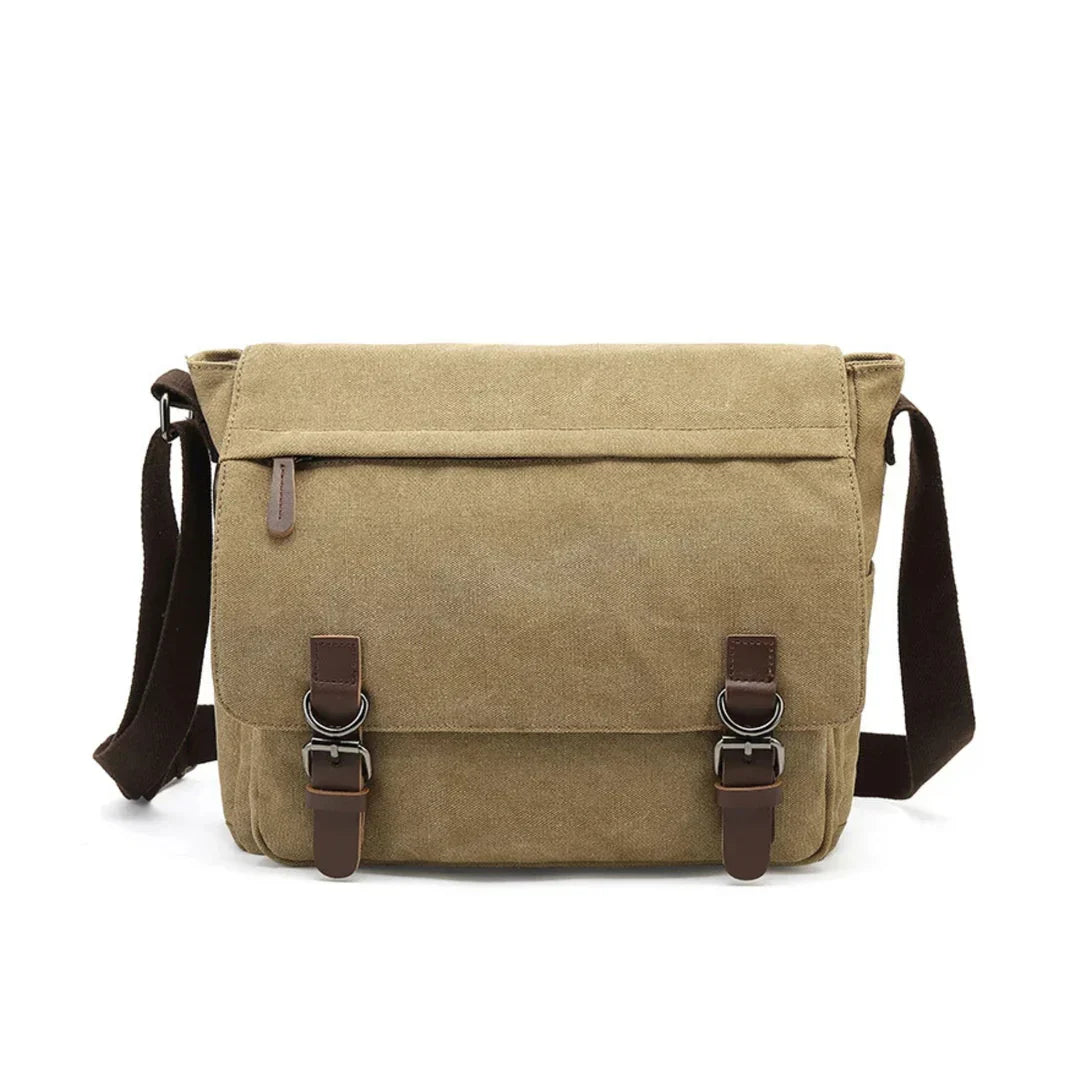 Assortiment robuuste heren canvas schoudertassen in bruin, zwart, blauw en legergroen.