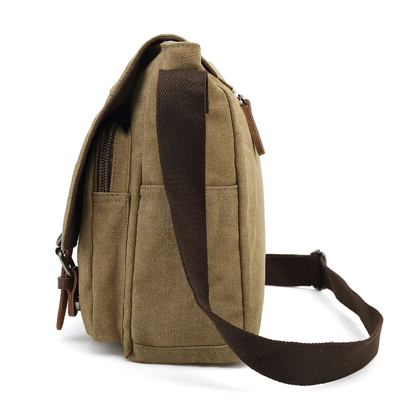 Detail van de grijze robuuste canvas tas: stevige sluitingen en vakken voor heren.