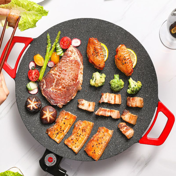 Elektrische tafelgrill met rookvrije technologie, geniet binnen van BBQ-smaak zonder rookontwikkeling.