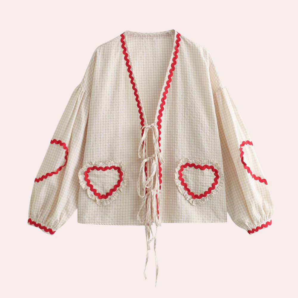 "Roze dames top met hartjesapplicatie en korte mouwen, comfortabele pasvorm ideaal voor casual outfits."