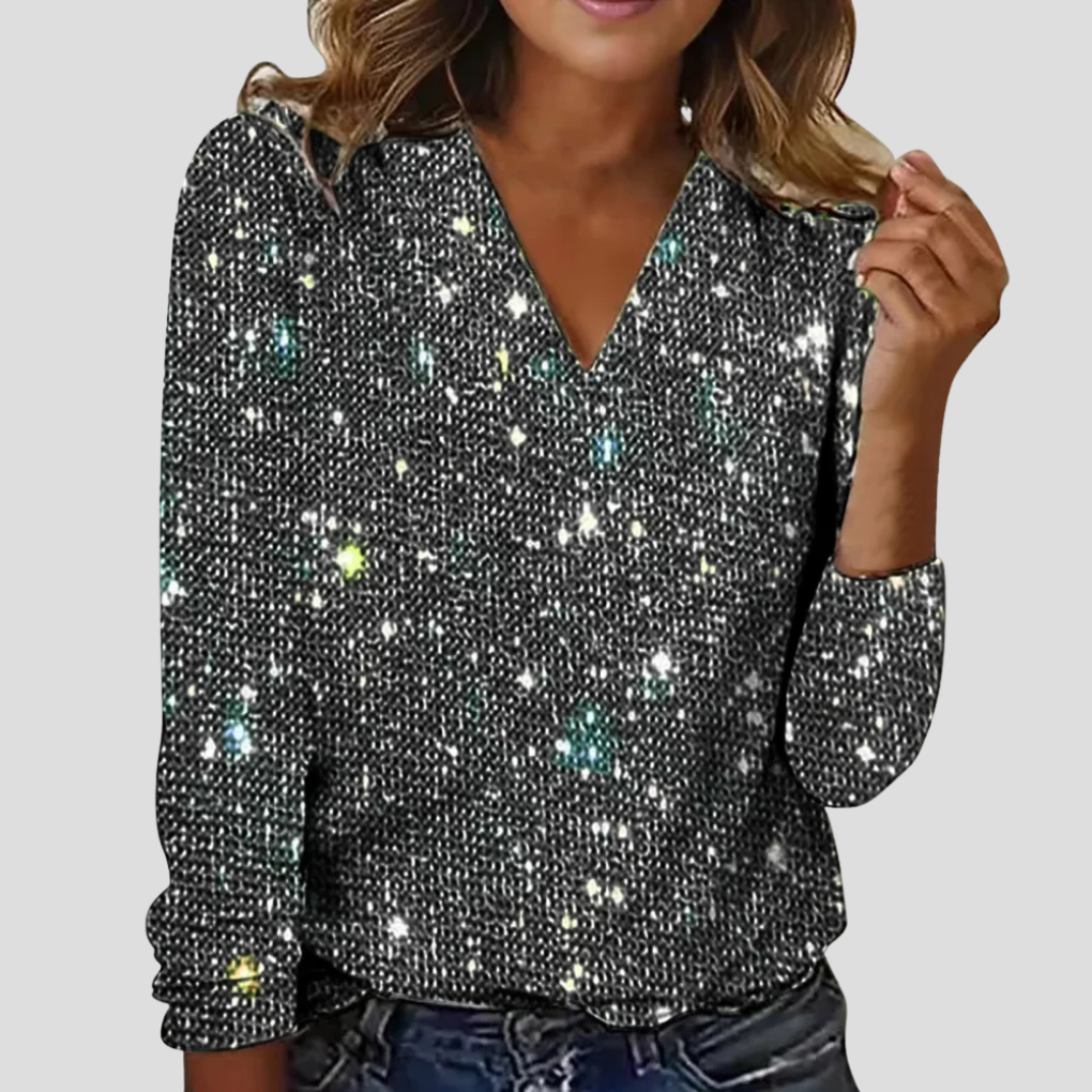 Sprankelende dames glitterblouse met pailletten, V-hals en lange mouwen, ideaal voor feestkleding en avondje uit.