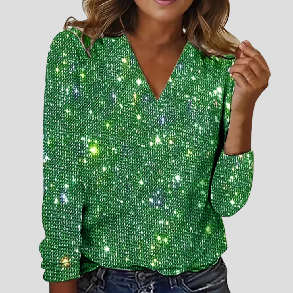 Dames glitterblouse met V-hals en lange mouwen, versierd met pailletten voor een chique en feestelijke damesmode outfit.