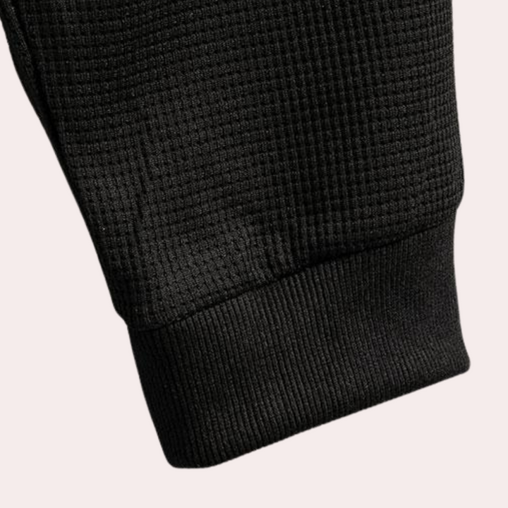 "Stijlvol joggingpak voor heren, navy met grijze accenten, comfortabele pasvorm, ideaal voor casual en thuisgebruik."