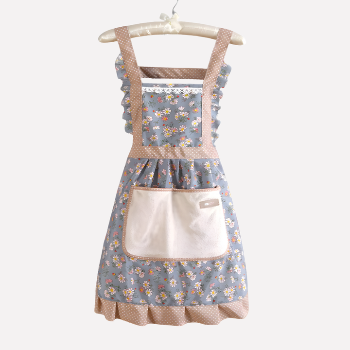 Stijlvol unisex keukenschort met levendig bloemenpatroon in blauw, groen en rosa, ideaal voor koken en bakken.