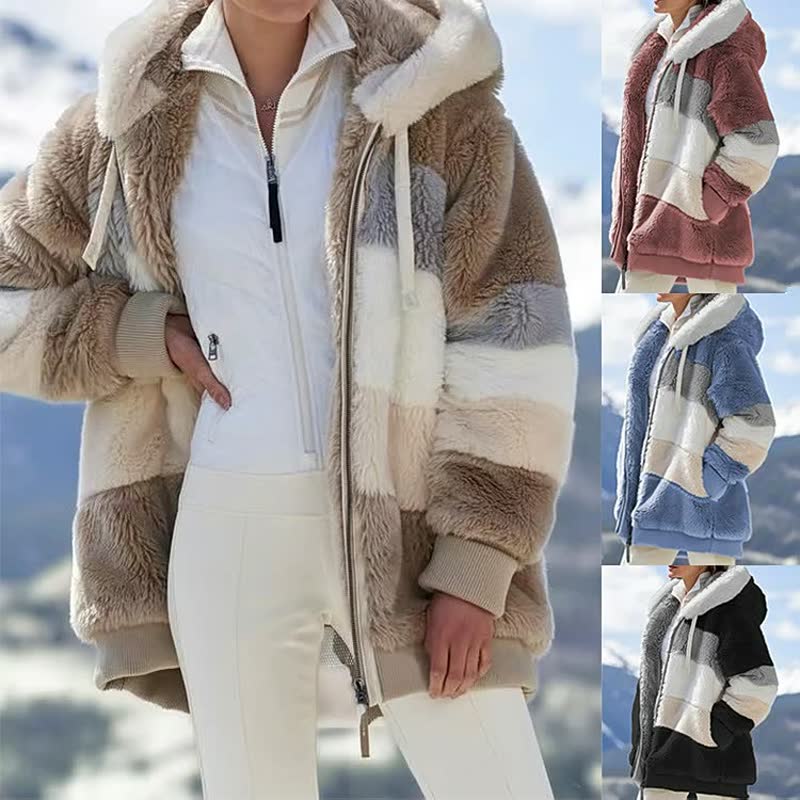Achteraanzicht van de warme, oversized dames winterjas. Toont de comfortabele pasvorm.