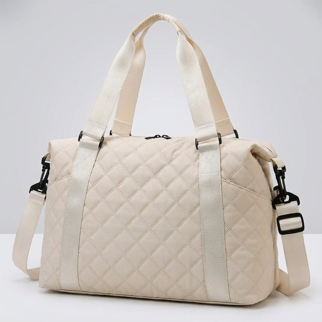 Elegante gewatteerde duffelbag voor dames, functioneel voor reizen, weekendjes weg of sport.