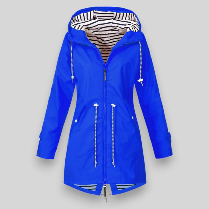 Beschermende dames jas: anorak regenjas met capuchon, ontworpen voor comfort en stijl in de herfst.