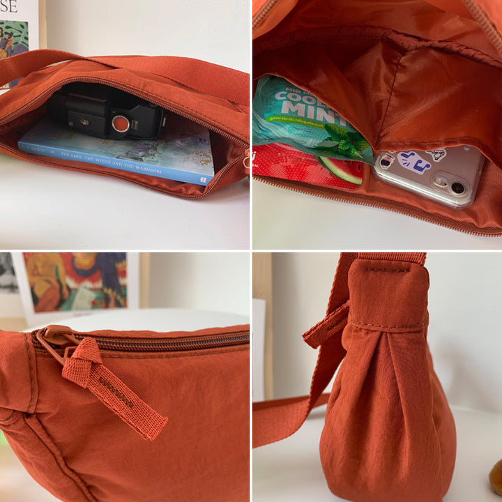 Veelzijdige halve maan tas, draagbaar als crossbody of elegante schoudertas.