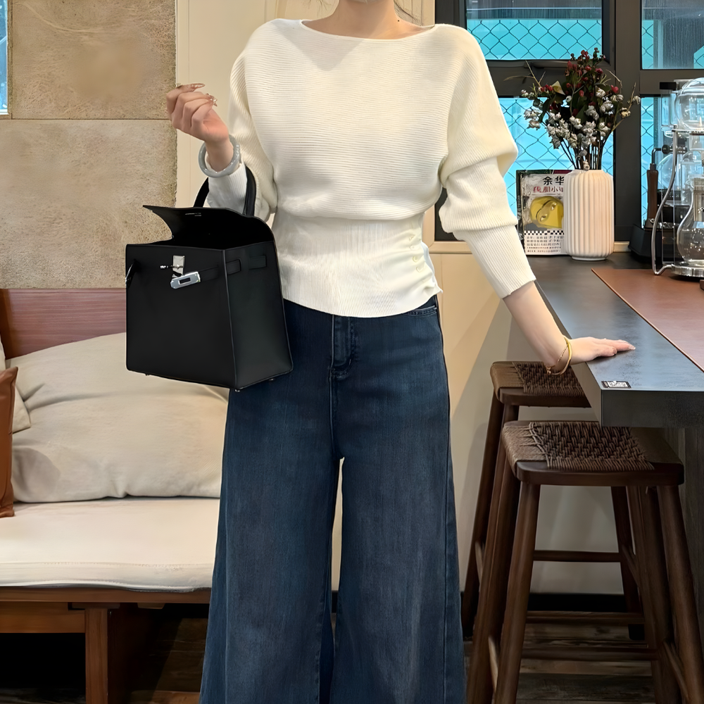 Veelzijdige gebreide off-shoulder damespullover voor een casual, ontspannen look. Ideaal voor herfst en winter.