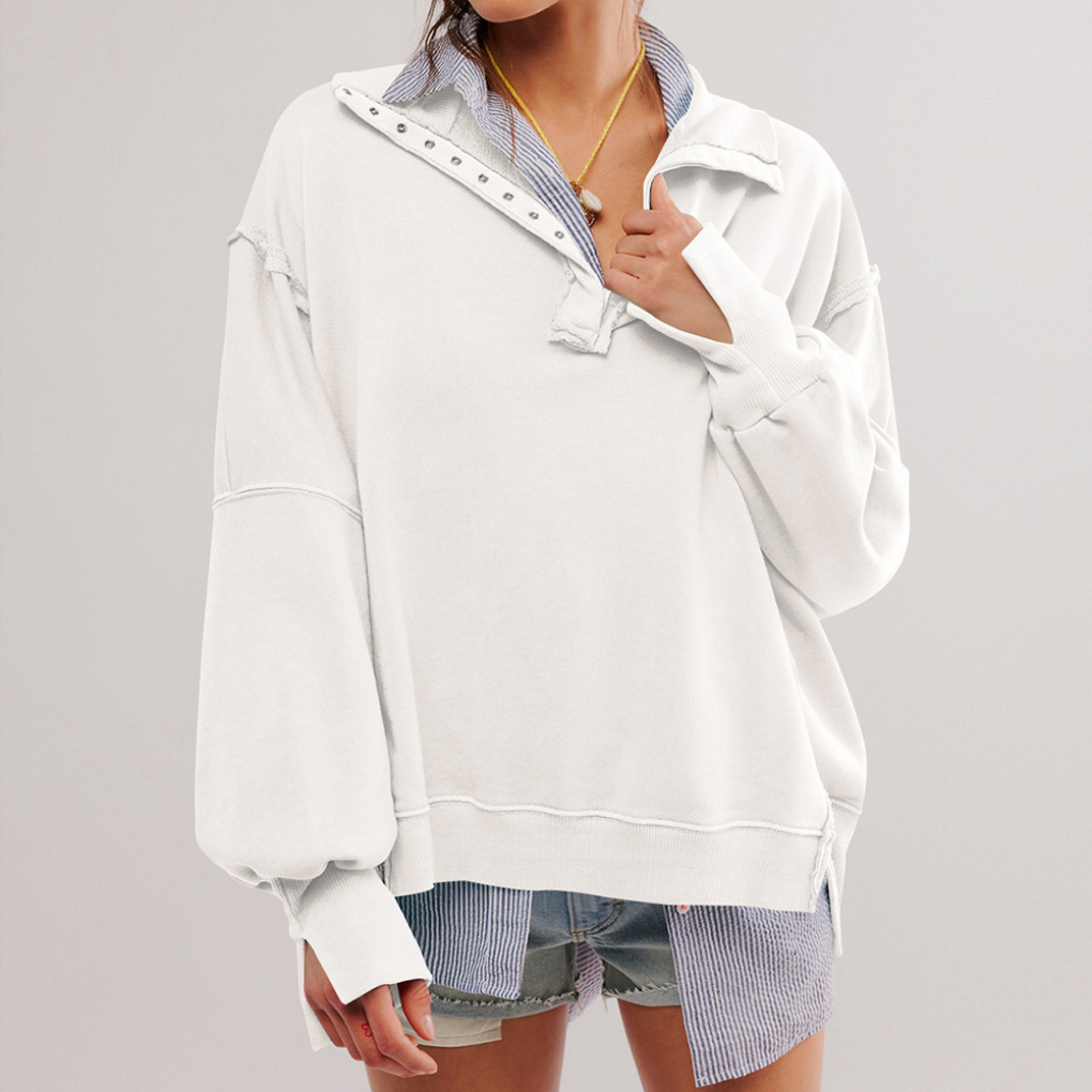 Losvallende oversized dames pullover met lange mouwen en Henley hals. Perfect voor comfortabele, stijlvolle casual kleding.