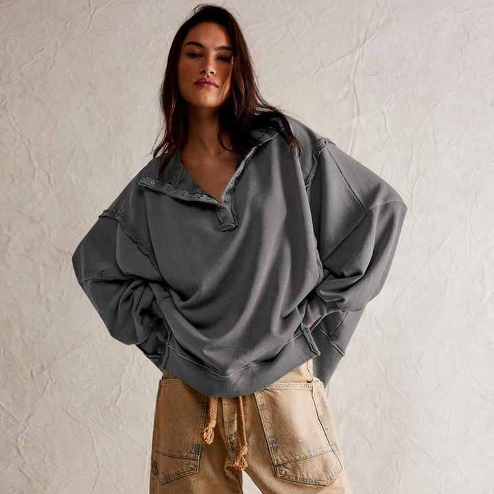 Casual dames oversized pullover met lange mouwen en een unieke Henley hals. Stijlvolle en comfortabele damestop.