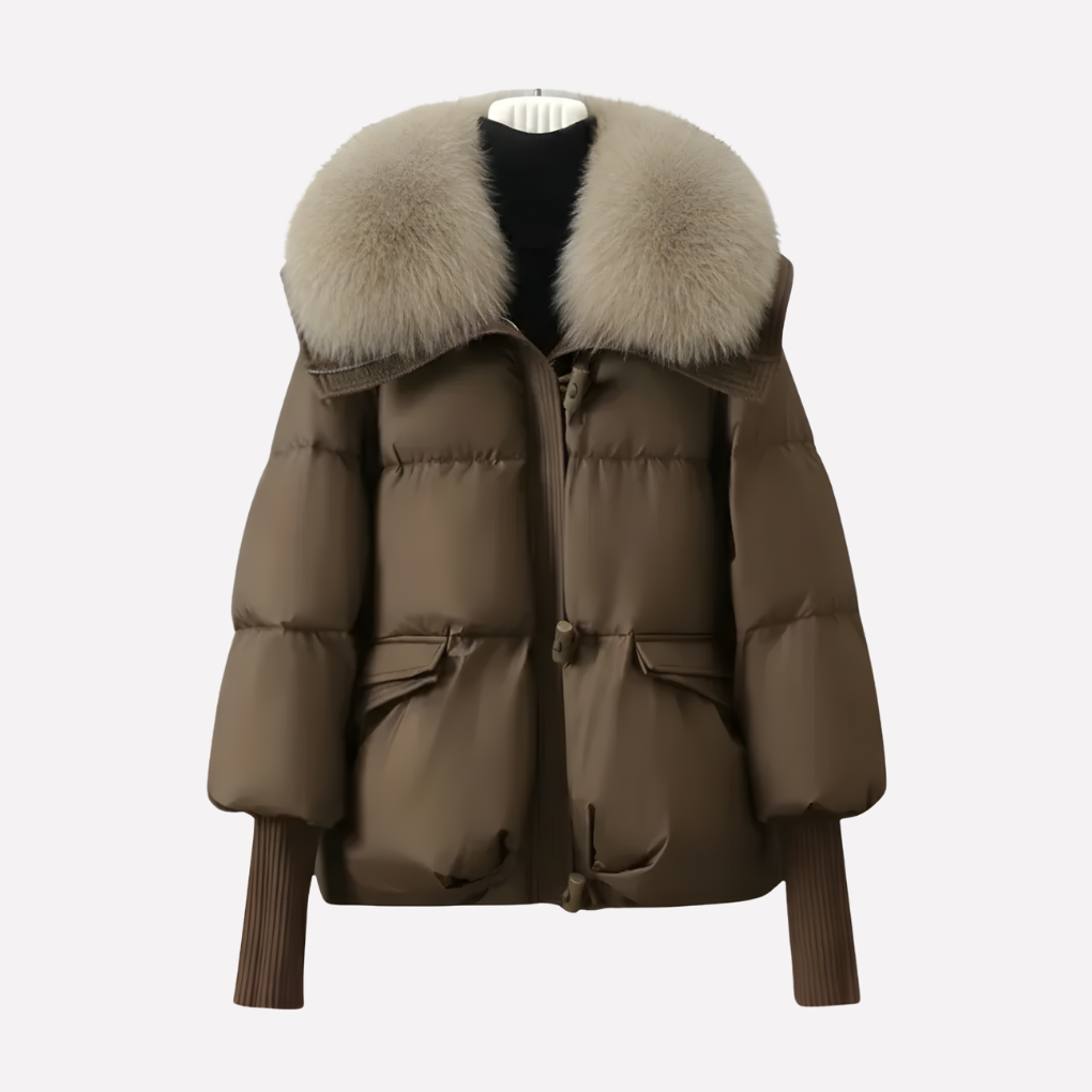 Stijlvolle dames pufferjas met luxe faux fur kraag, warm gewatteerd. Beschikbaar in beige, zwart en bruin.