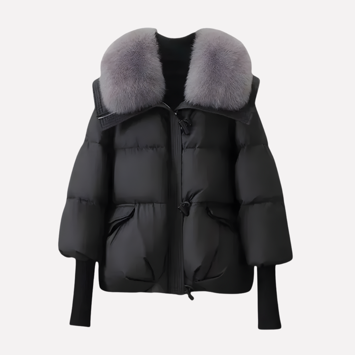 Elegante dames pufferjas, gewatteerd en warm, met luxe faux fur kraag. Een stijlvolle en comfortabele winterjas.