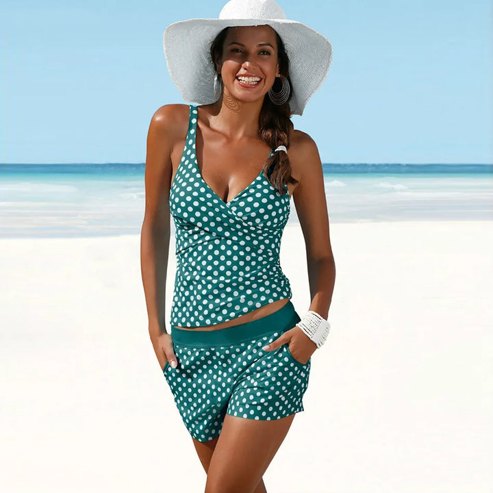 Stijlvolle dames tankiniset met retro stippenprint. Comfortabele badmode met push-up zwemtop, perfect voor de zomer.