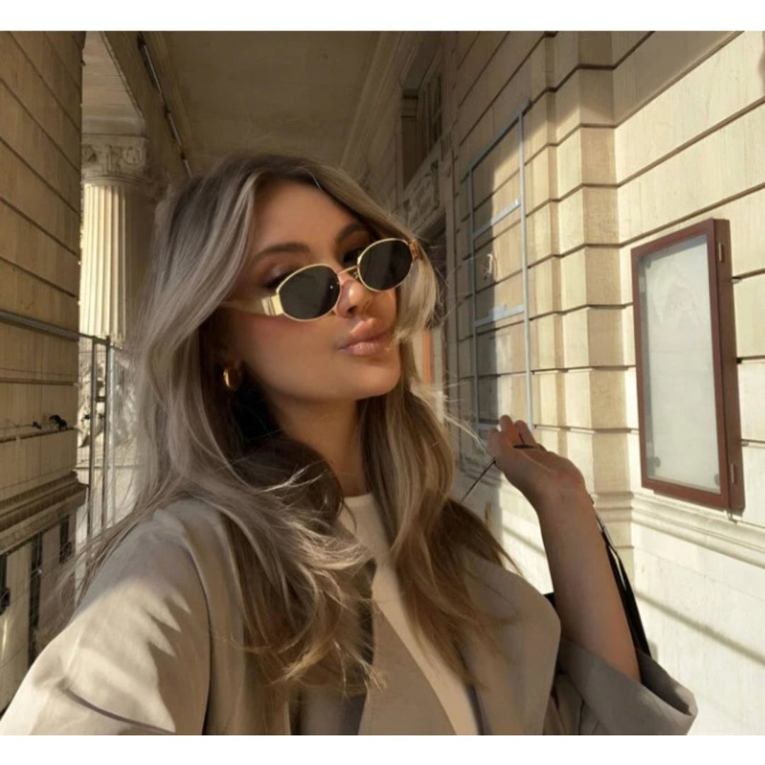 Stijlvolle dames zonnebril met trendy ovale glazen en optimale UV-bescherming. Perfect voor zomerse dagen.