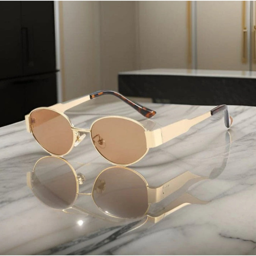 Chique dames zonnebril met ovale glazen, ontworpen voor comfort en maximale UV-bescherming. Een tijdloos design.