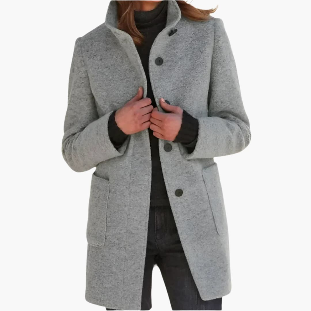 Comfortabele damesjas met opstaande kraag, een veelzijdig middellang model voor een elegante en praktische look.