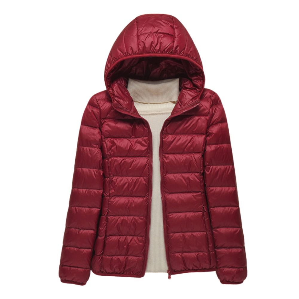 Moderne dames gewatteerde jas met functionele capuchon. Comfortabele en warme keuze voor herfst- en winterdagen.